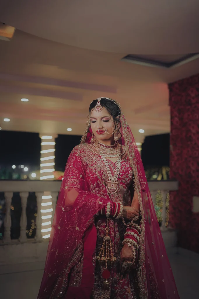 Bridal portrait in a red lehenga, photographed by Amit Studio