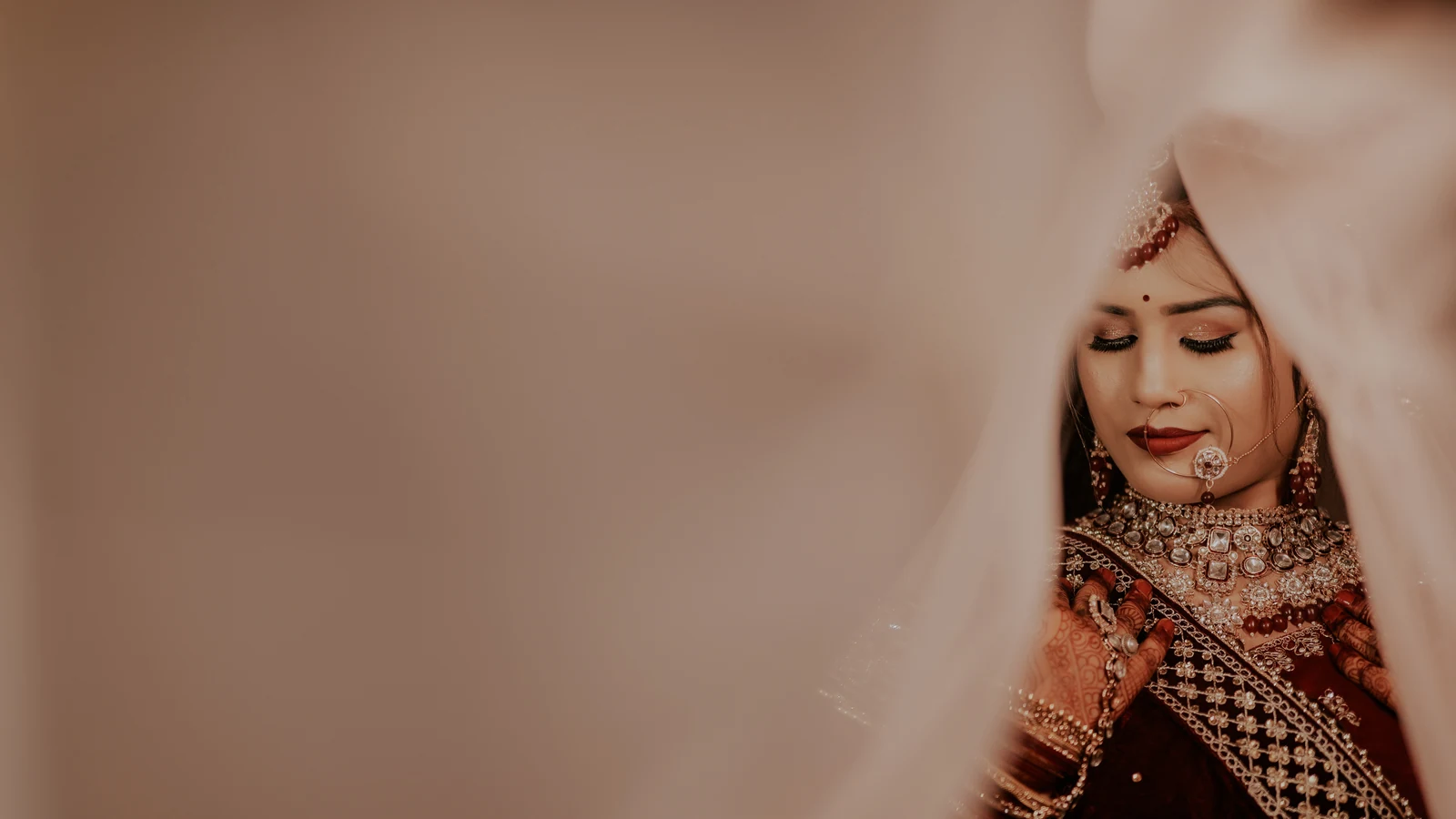 A quiet portrait through a soft bridal veil