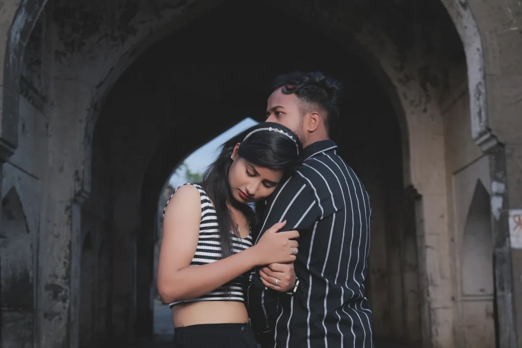 An embrace beneath an archway