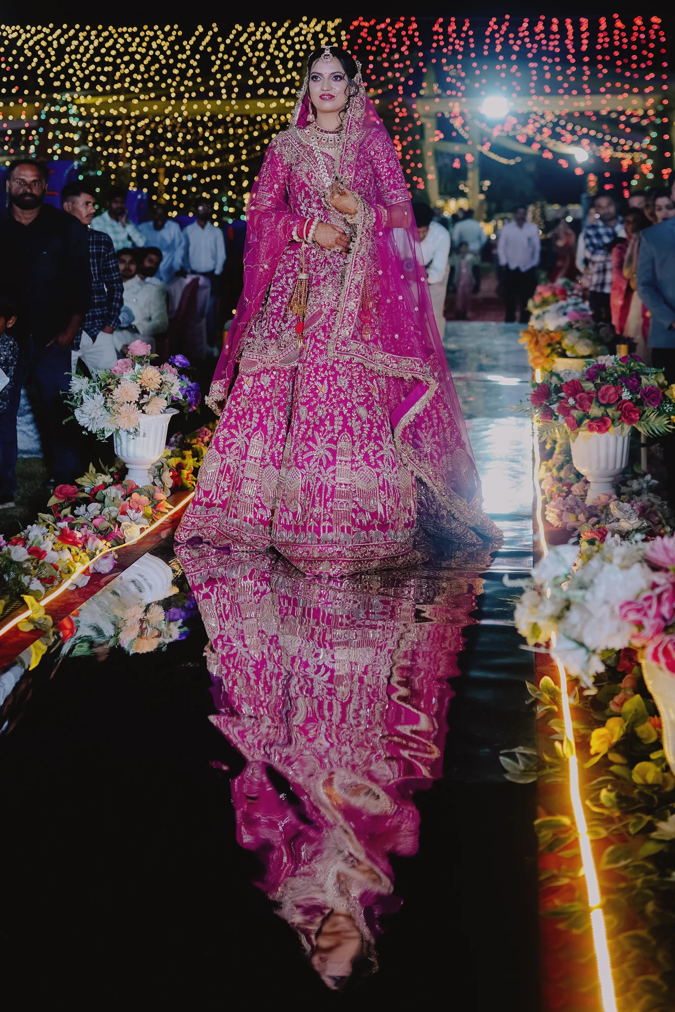 A bride and her reflection on the wedding aisle