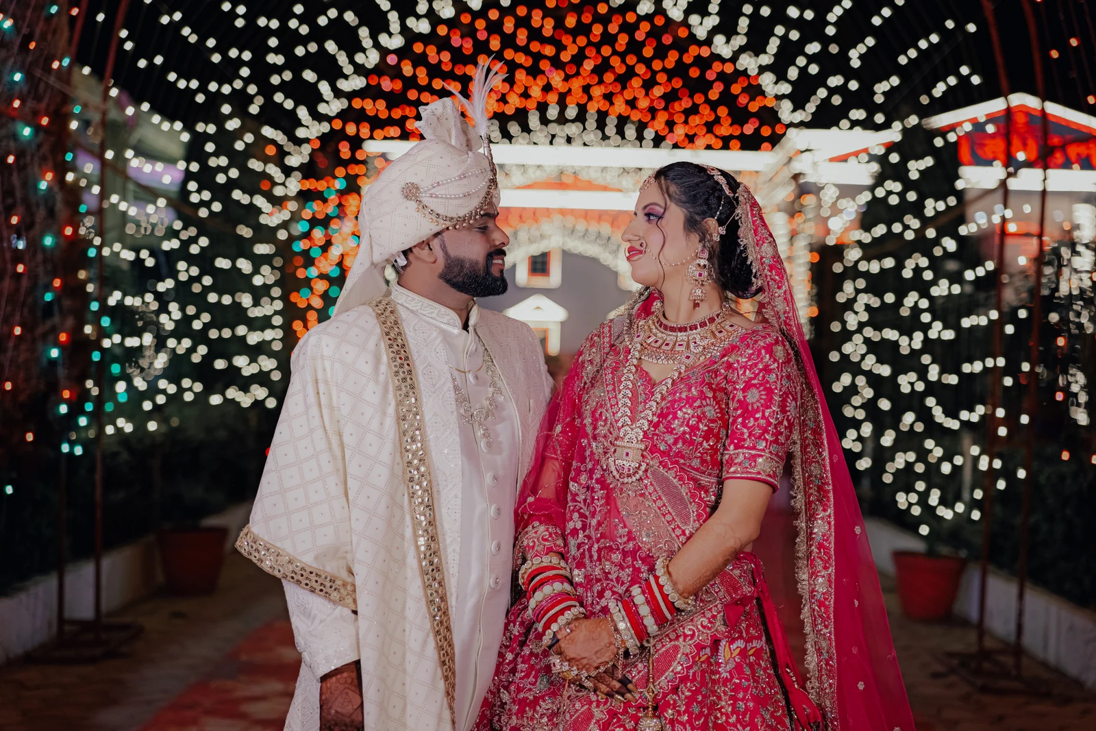 Shefali and Ajay beneath the wedding lights